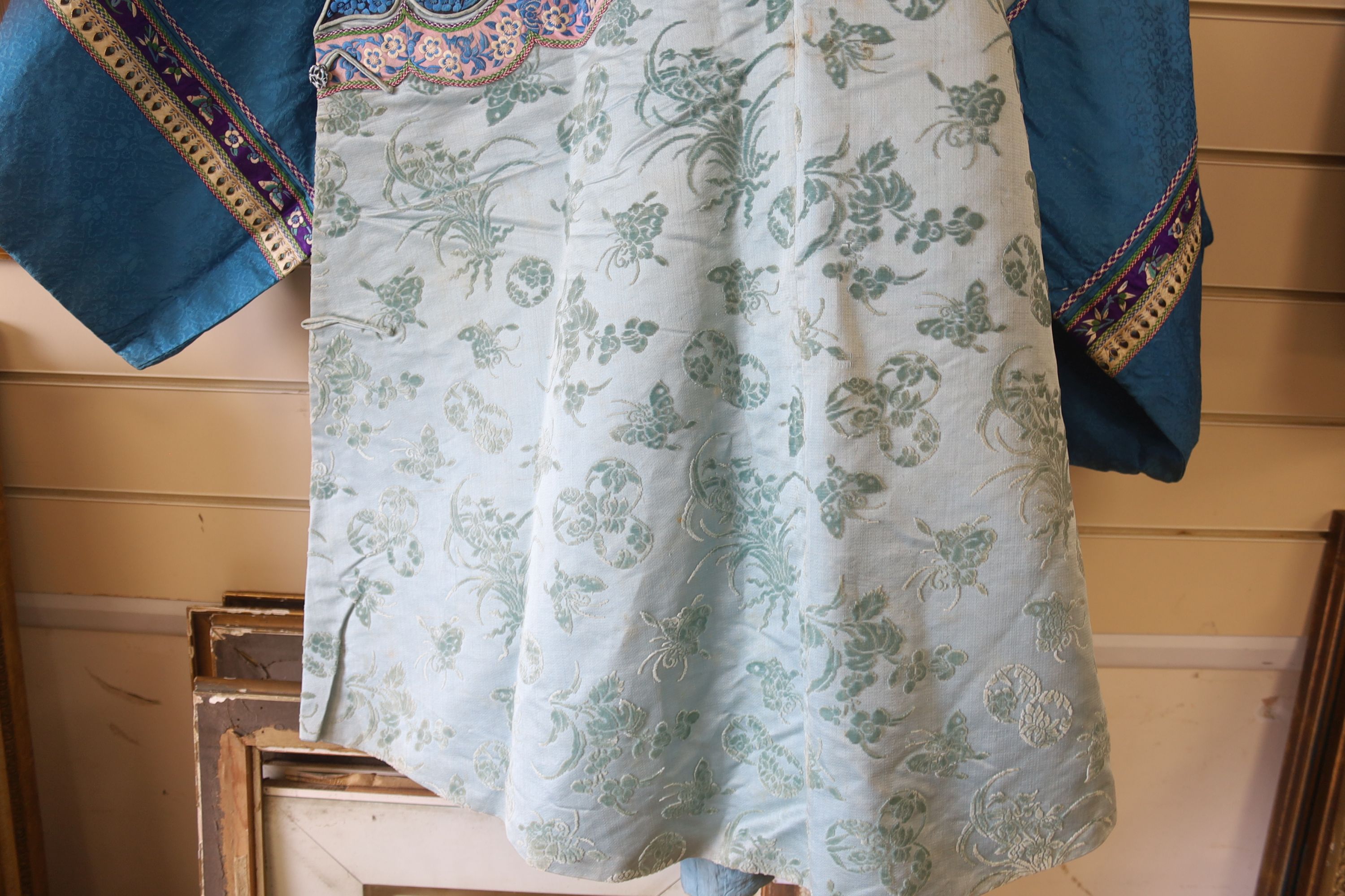 A 1930's Chinese silk robe, with wide embroidered cuffs and all over art work velvet motifs on silk, length 82cm